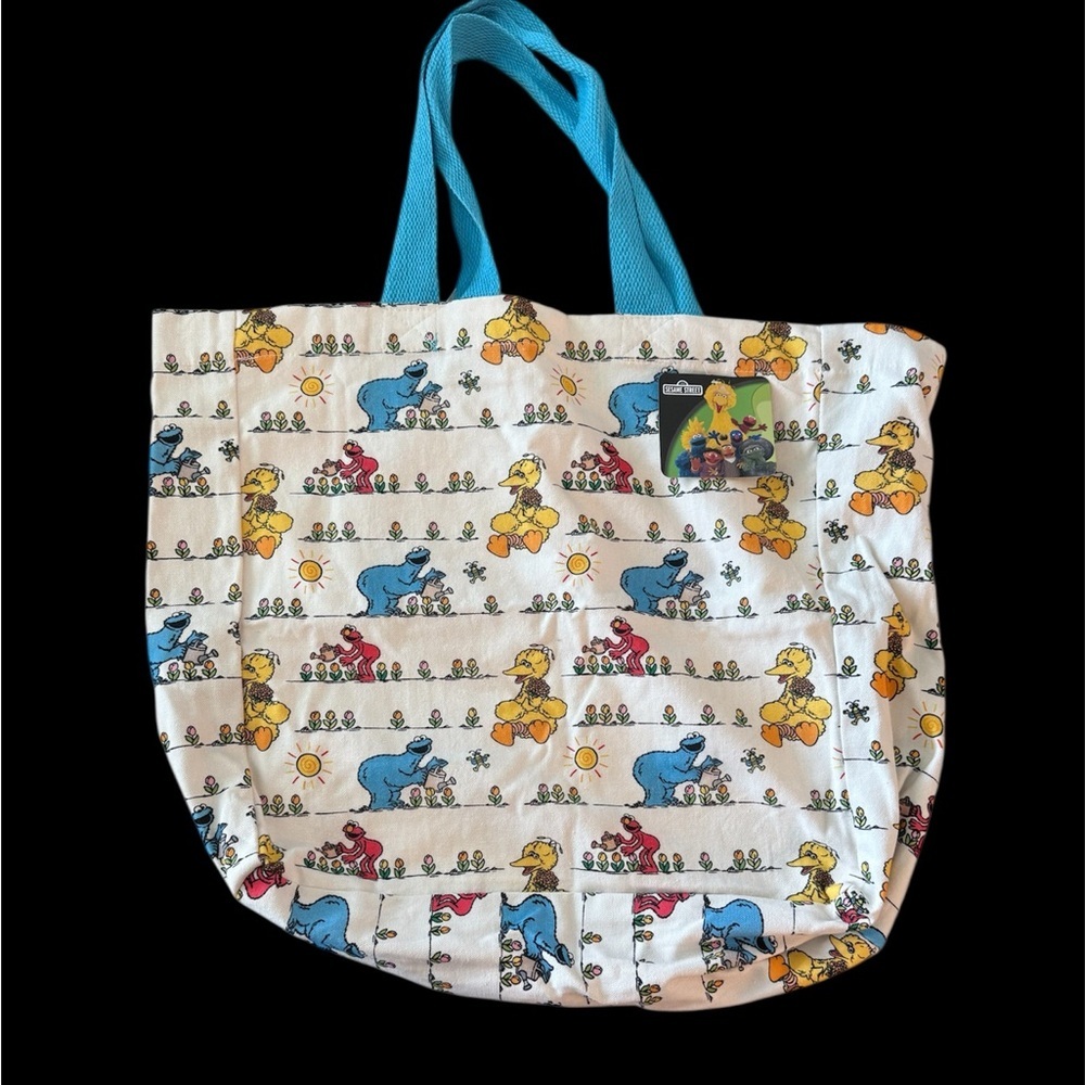Sesame Street Tote Bag with Blue Handles and Multicolor Character Pattern